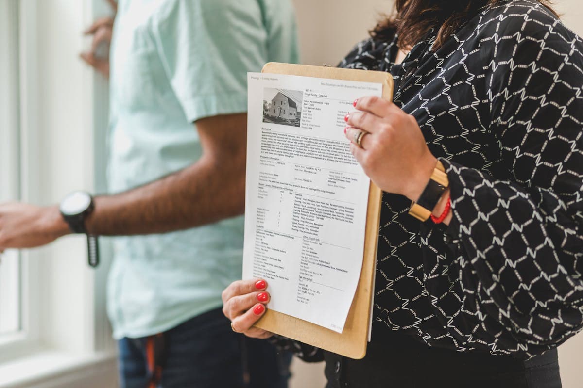 Landlord reviewing rental property paperwork at a desk